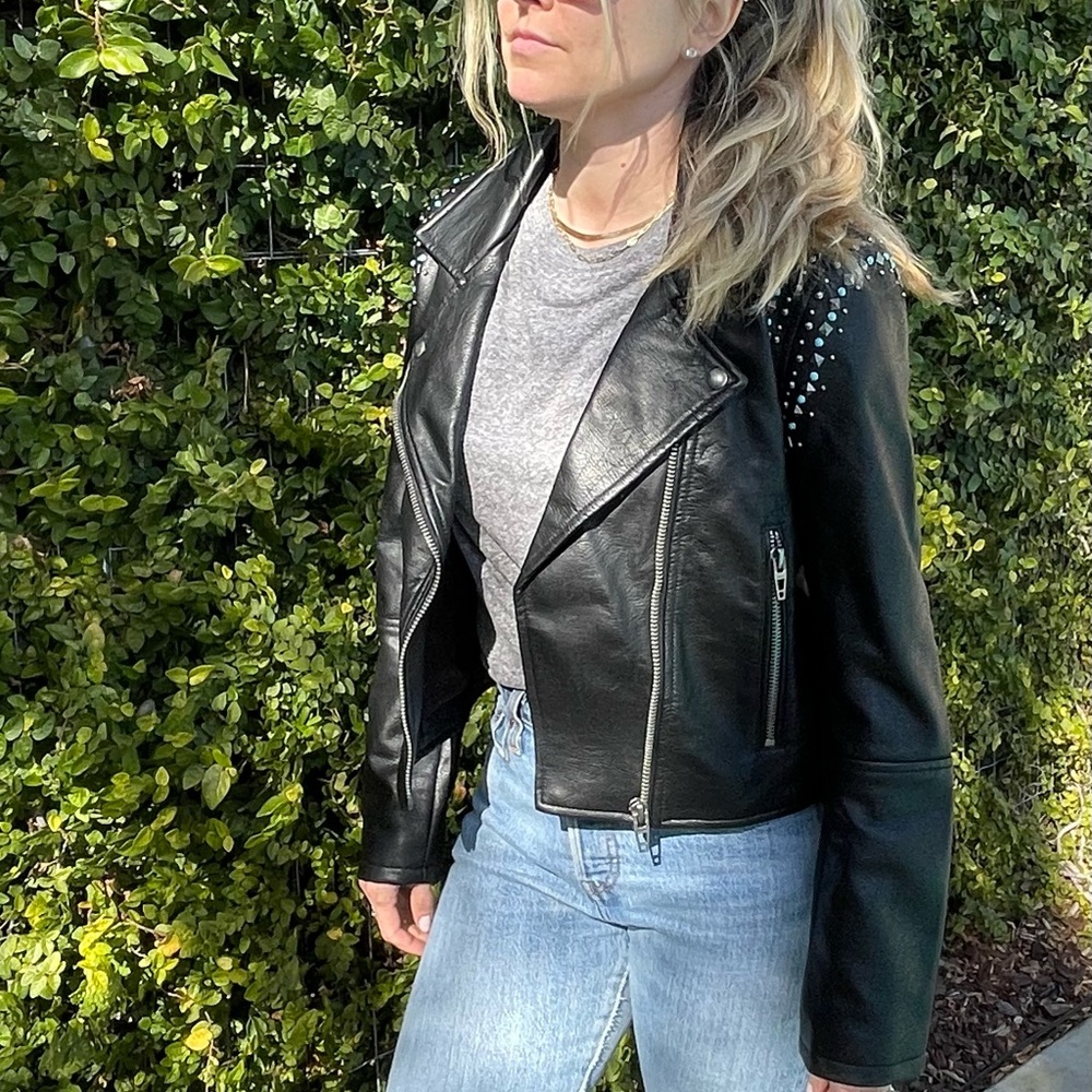 Blank NYC faux leather coat with studs and turquoise details.